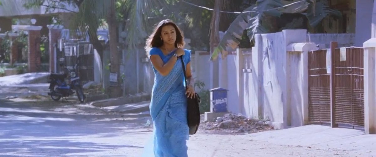 Introduction of JessieA Syrian, Malayali Christian girl who is in blue cotton saree, just casually walking down the street. And finally she reached her 'new home'.