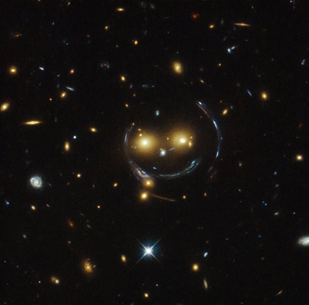 Galaxy cluster SDSS J1038+4849 and the arced, gravitationally lensed images of even more distant galaxies know that things seem pretty grim here on Earth, but nonetheless hope your day is going okay.Image Credit: NASA / ESA / Hubble Space Telescope