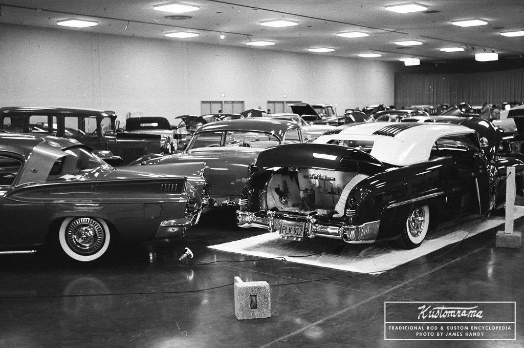 A rear end shot of Al McKeown's 1951 Mercury and Gary Elmore's 1953 Studebaker custom taken by James Handy at the 1962 San Jose Autorama. More photos from the same show and the Handy Collection can be found on Kustomrama: bit.ly/2ZmJOeV