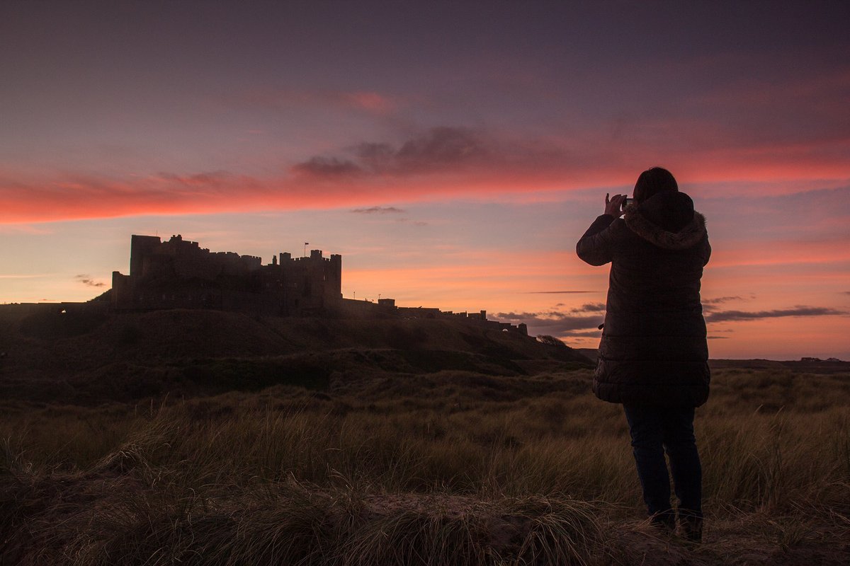 Bamburgh Castle in Northumberland at sunset.