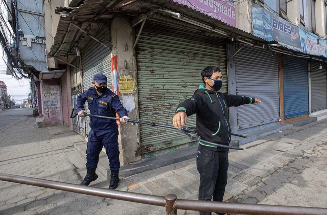 siobhanheanue's tweet photo. Amazing photos of police in #Nepal are using 6ft-long metal clamps to detain people who have violated the country’s #Covid_19 #lockdown 📸 by @Narendraphoto https://t.co/wv5ccEFaIw