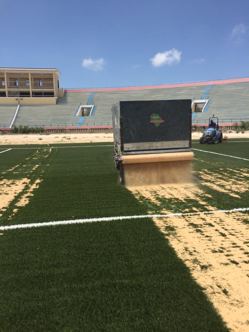 gabowduale's tweet photo. The spreading of siltic sand and rubber to increase comfort and grip marks the final stage of the football pitch of Mogadishu Stadium. The @EU_in_Somalia and @NorwayInSomalia partnered with the Somali people to wake this icon back to life. https://t.co/bgBkCVCyOU
