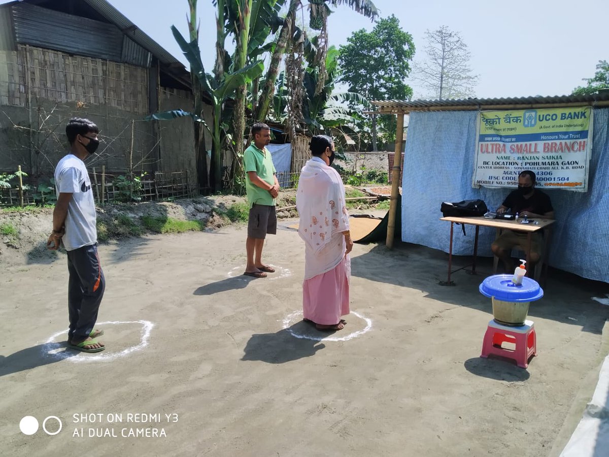 UCOBankOfficial's tweet photo. UCO Bank's Business Correspondents  at services while maintaining social distancing measures.
#UCOBank is determined to serve the nation while fighting COVID-19
CSP Name: Ranjan Saikia, Vill: Pahumara gaon, Jangrai Branch, State: WB
@DFSFightsCorona @RBI @UPI_NPCI @PMOIndia https://t.co/2kAh572WZX