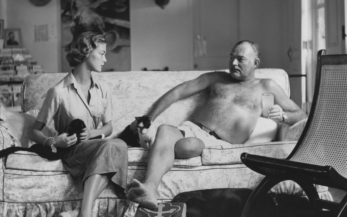 Ernest Hemingway with two cats, a dog and the model Jean Patchett at his ra...