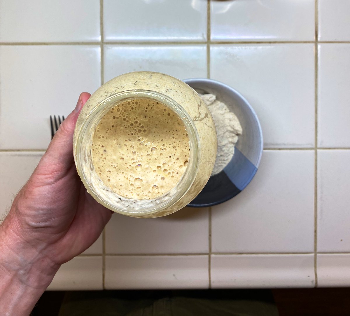 It’s a HIGHLY technical process in which you make a small amount of very wet dough: some flour, a bit of your starter culture, and some water. Your bread recipe will guide you how much you’ll need; I usually make 150% of what’s needed, and give the rest to a friend- a new starter