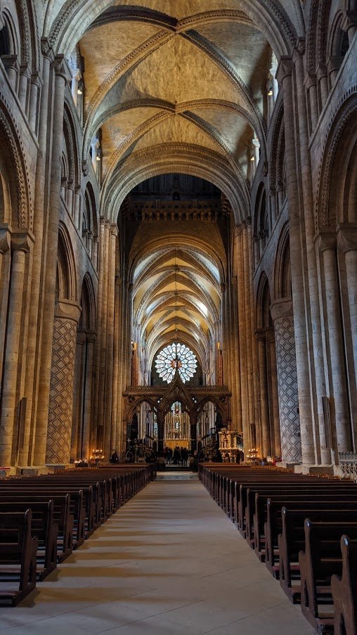 Chonky cathedrals are generally older and their official name is "Romanesque" or "Norman". They're also rarely pure Chonk, with later additions. We hadn't really worked out what kept huge buildings up at that point so thick walls, big pillars, and small windows were the style.