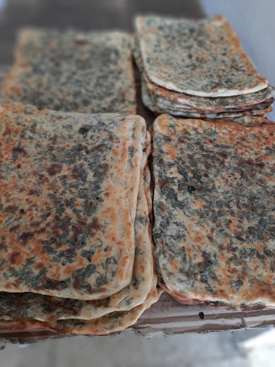Zaatar (mtabba2, fteri etc) is baked dough with green thyme and olive oil (now some people add onions and cheese). It is very popular between villagers and one of my favorites.