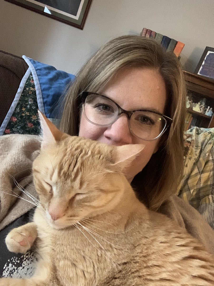 Cat picture of the day March 29: me and Gus all snuggled up after church.