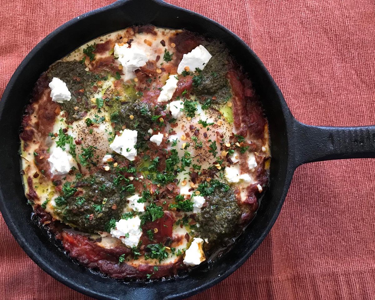 eatsmorefunwk's tweet photo. #shakshuka part deux. This one is vegetarian topped with Israeli sheep’s milk feta in brine, pesto &amp; pepper flakes👌🏼 #shakshouka #chef #cheflife #chefslife #cookingathome #homemade #castironcooking #quarantine #socialdistancing  #buzzfeedfood #huffposttaste https://t.co/C2hyKdGNSl
