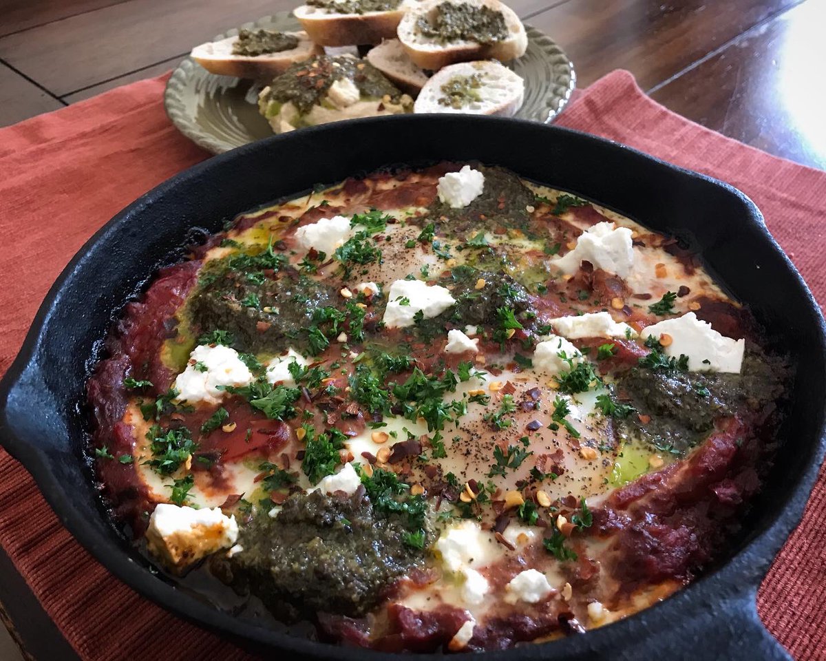 eatsmorefunwk's tweet photo. #shakshuka part deux. This one is vegetarian topped with Israeli sheep’s milk feta in brine, pesto &amp; pepper flakes👌🏼 #shakshouka #chef #cheflife #chefslife #cookingathome #homemade #castironcooking #quarantine #socialdistancing  #buzzfeedfood #huffposttaste https://t.co/C2hyKdGNSl