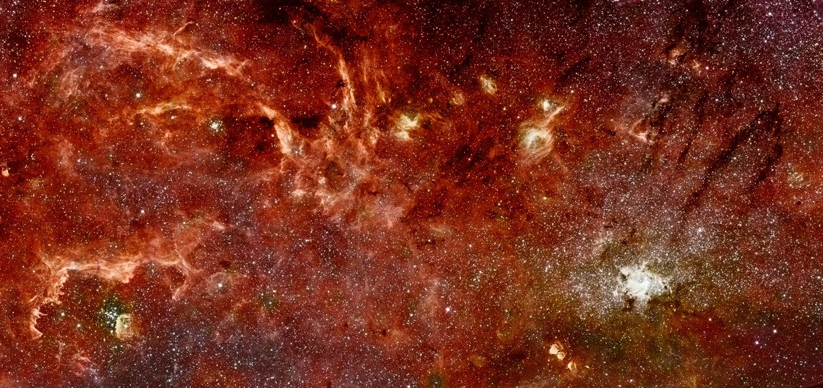 Earlier that same year, Hubble and Spitzer (“a Hubble-Spitzer joint”) produced this infrared image of roughly the same region, a patch of sky in our galactic core about 300 light years across.Image: NASA, ESA and Q.D. Wang (University of Massachusetts, Amherst)