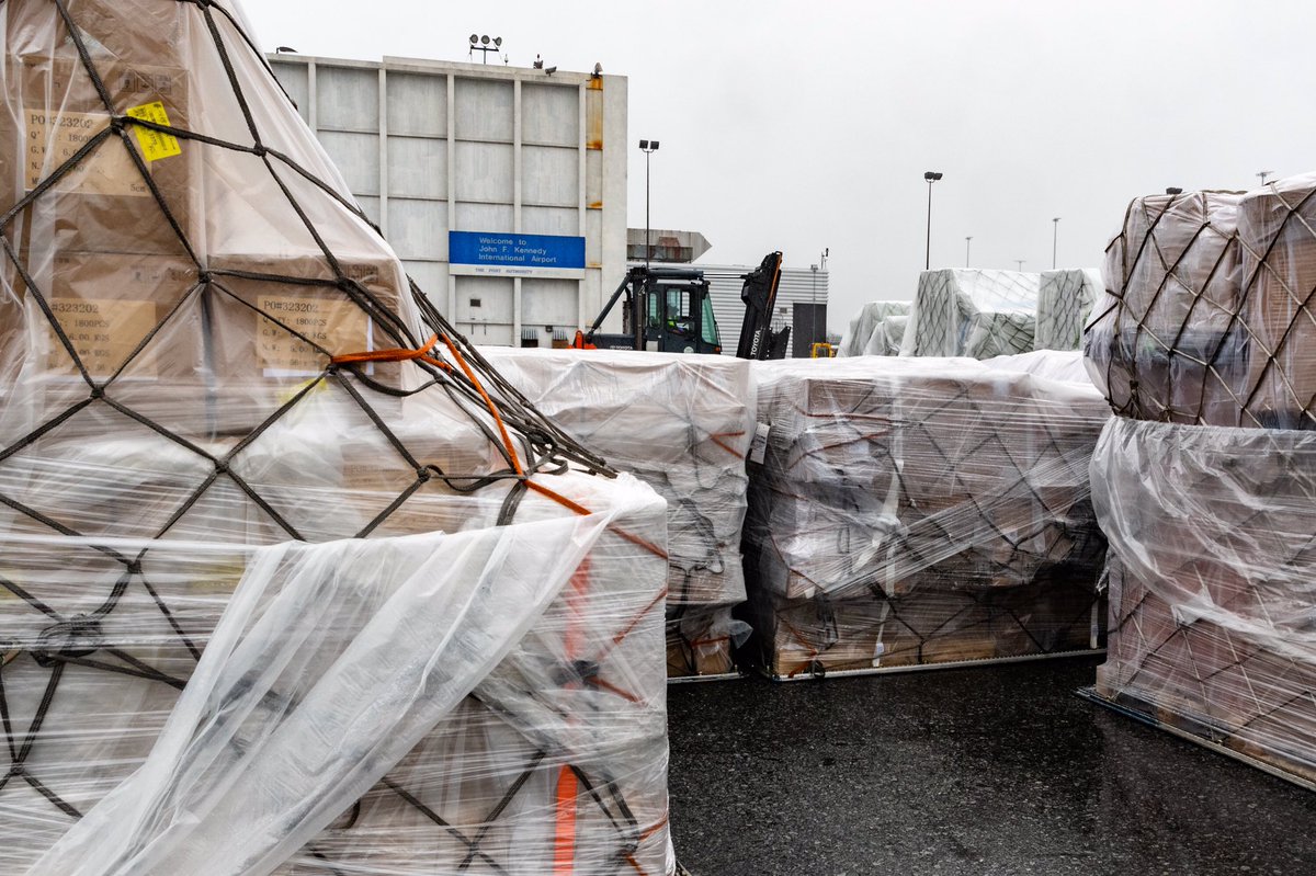 Pallets of supplies wrapped up and sitting on a lot outside