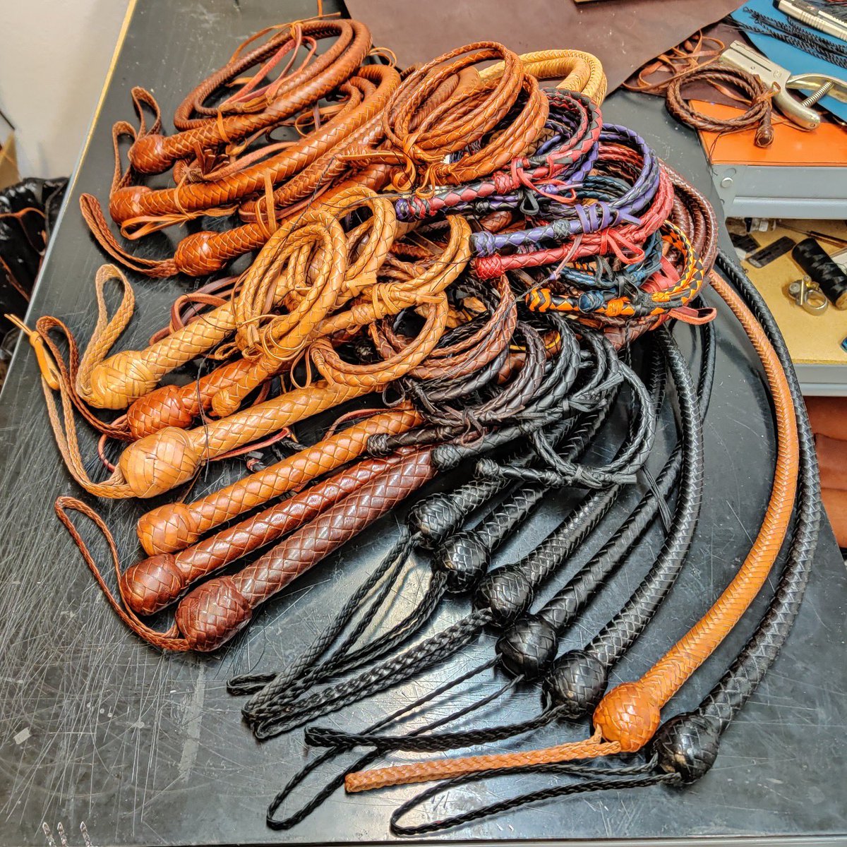 A pile of whips in the shop! Some Little Snappers, some full size whips available at our instock page now(midwestwhips.com/instock), and a couple suprises coming soon!

#Whip #Whips #LeatherWhip #LeatherCraft #workshop #LeatherWork #bullwhip #Pile #PileOfWhips