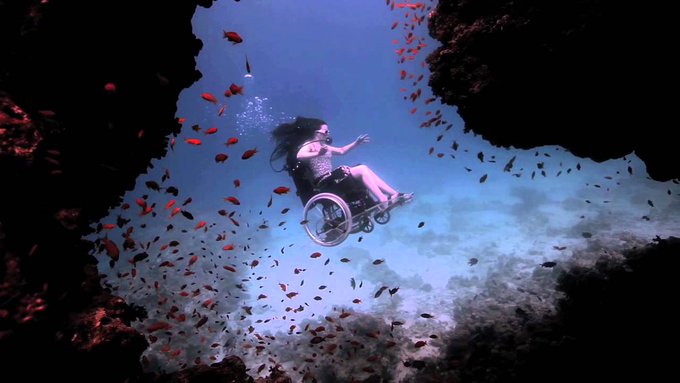UK artist Susan Austin, underwater performance in wheelchair, 2013 aimed to challenge perceptions of disability #womensart