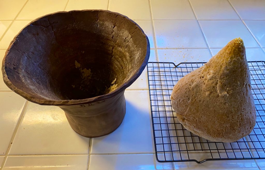 As I mention in the thread above, the ancient Egyptians of that time period didn’t use ovens like we do today. They baked in conical clay pots call “bedja.” Here’s one we made. I’ve been practicing for months, baking in a modern oven with bedja so I get can a feel for it.