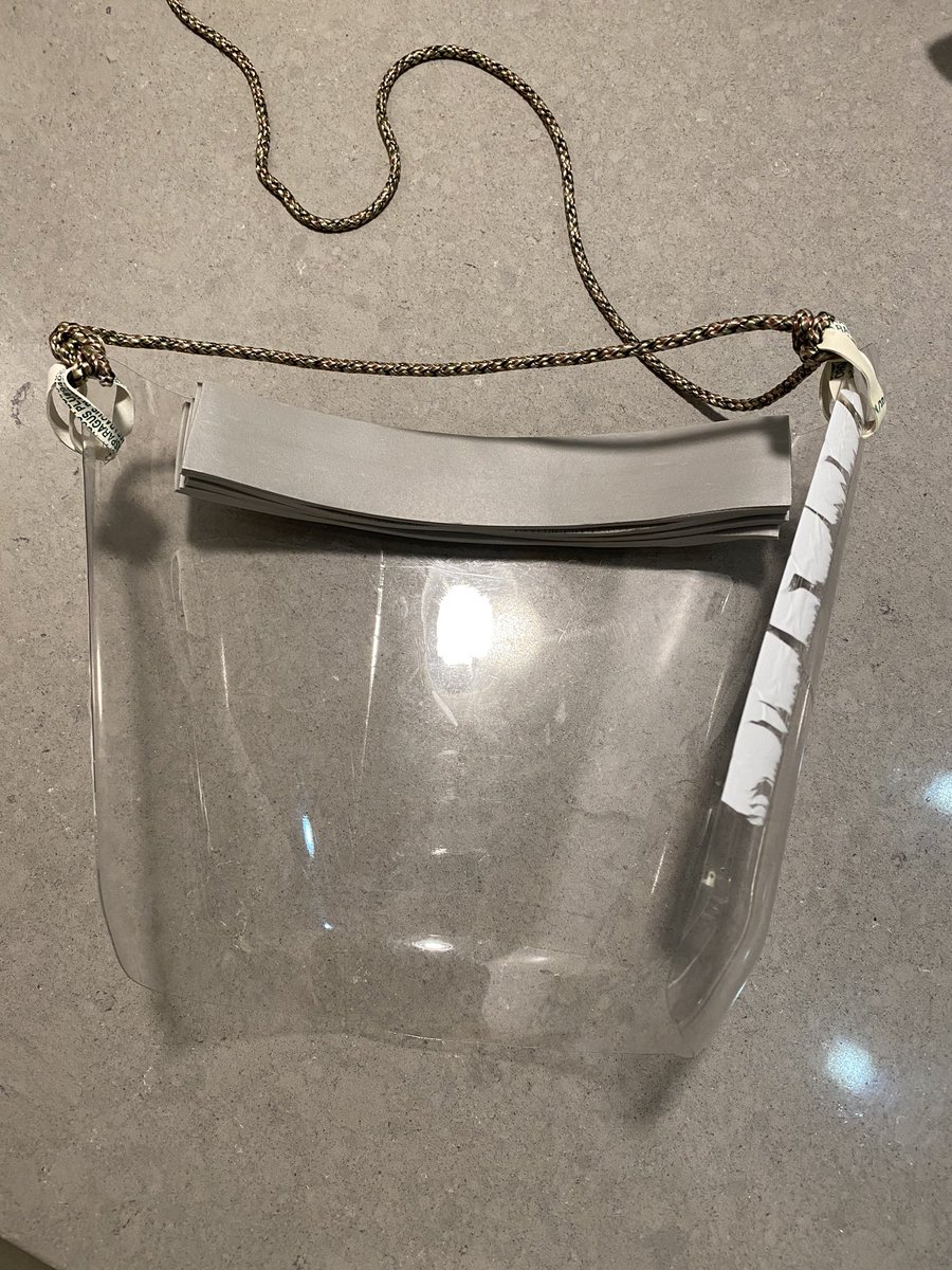 nonobject's tweet photo. Hi all humans, here is a simplest way to make a face mask from the 2 liter soda bottle. You need two rubber bands, one string, a piece of foam or dish sponge, and scissors and simple knife. Cut the top a couple inches from top edge, cut the bottom, then back vertical. Done! https://t.co/XcMQ93sME0