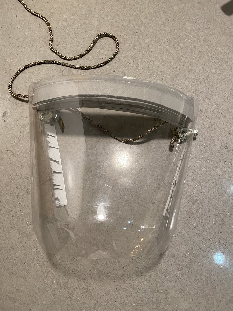 nonobject's tweet photo. Hi all humans, here is a simplest way to make a face mask from the 2 liter soda bottle. You need two rubber bands, one string, a piece of foam or dish sponge, and scissors and simple knife. Cut the top a couple inches from top edge, cut the bottom, then back vertical. Done! https://t.co/XcMQ93sME0