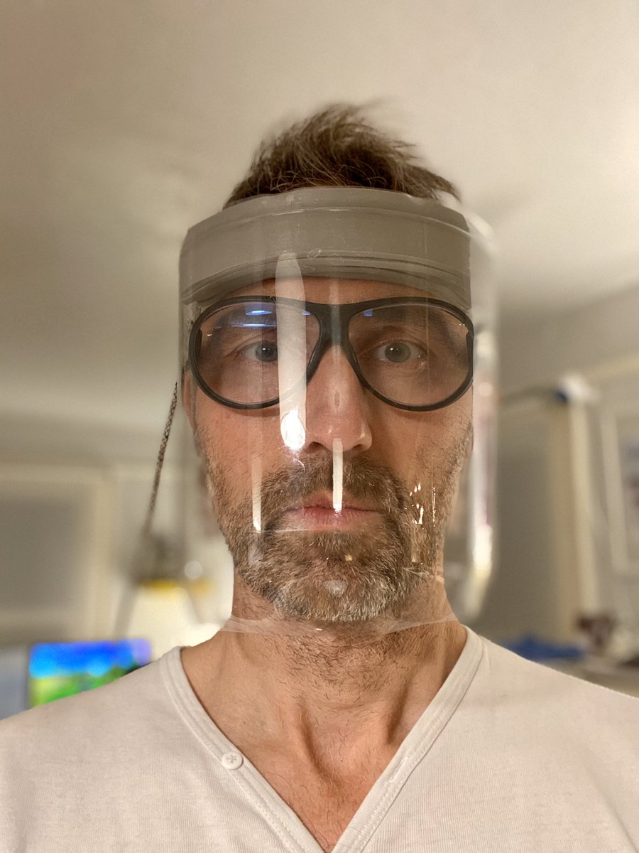 nonobject's tweet photo. Hi all humans, here is a simplest way to make a face mask from the 2 liter soda bottle. You need two rubber bands, one string, a piece of foam or dish sponge, and scissors and simple knife. Cut the top a couple inches from top edge, cut the bottom, then back vertical. Done! https://t.co/XcMQ93sME0