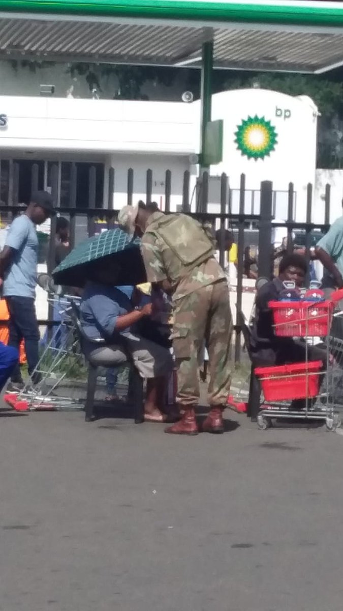 Maseniz's tweet photo. Serving water to yhe elderly while they wait in line at shoprite umlazi #SANDF #DAY4 #Whencoronaisover https://t.co/XzgEtiGN5w