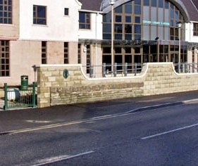 Our current building opened in 2003 and although Junction Road has been totally redeveloped since 1865, part of the old sea wall still remains intact. If you're looking for it just walk along the pavement in front of the library and have a closer look at our wall. ()End.