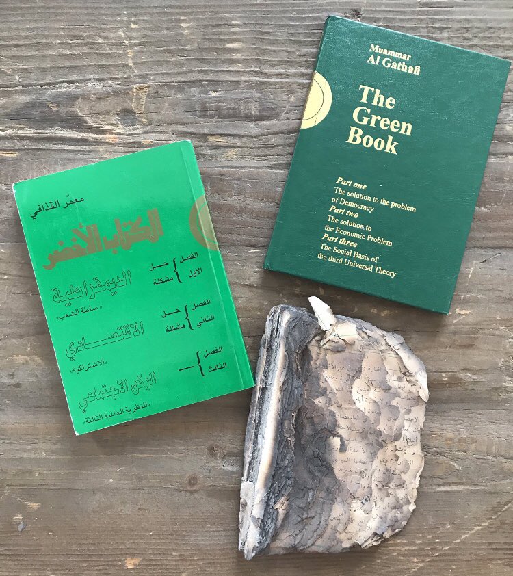 My 3 editions of Gaddafi’s Green Book - the ideological underpinning of his regime - found in  #Libya during 2011 uprising. The charred copy is from a bonfire in Benghazi in Feb 2011. People had flocked from across the city to toss their own copies of the Green Book on the blaze.