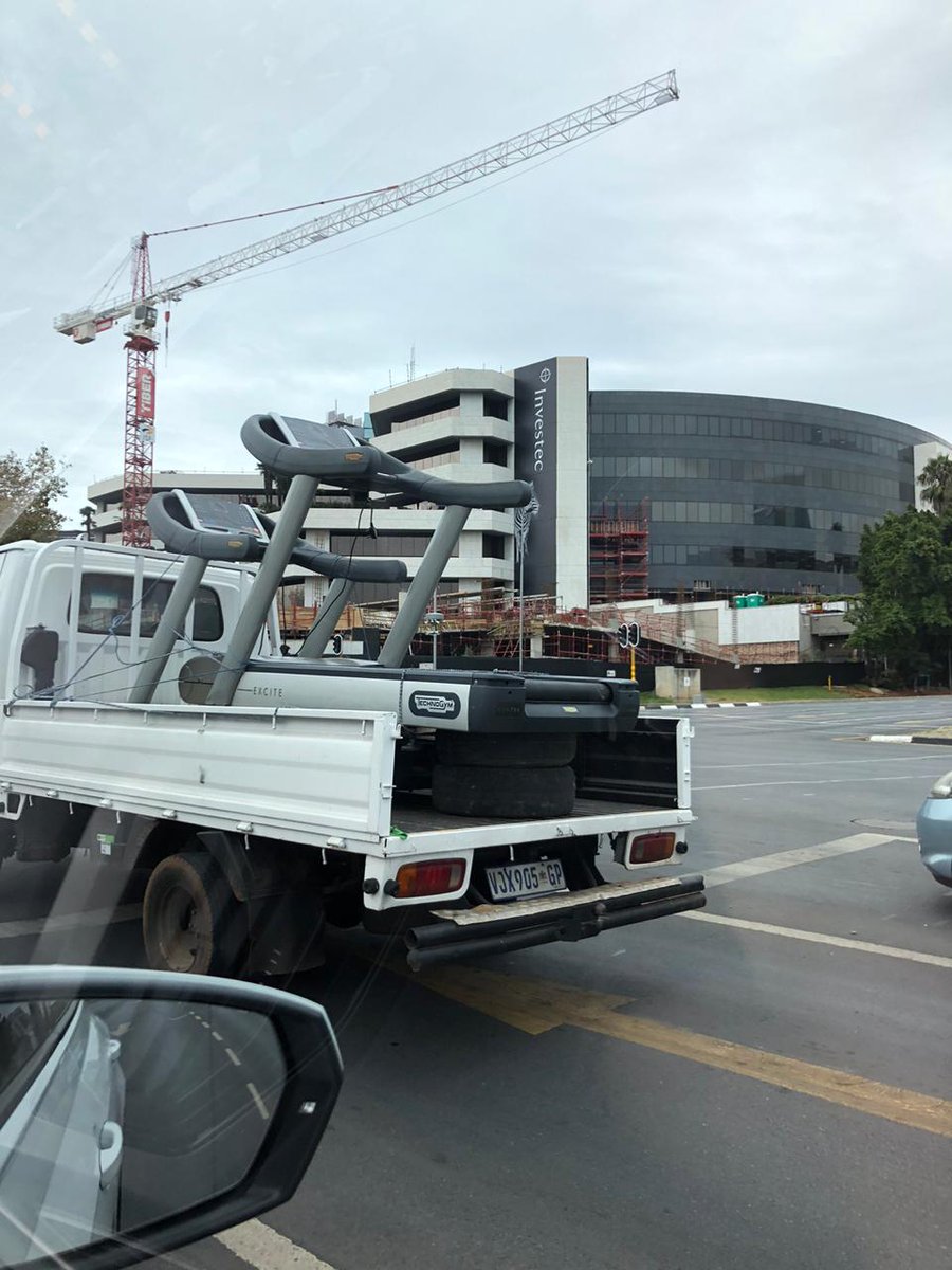 POWER987News's tweet photo. People transporting treadmills in Sandton due to the current jogging ban. Covid19SA #LockdowSA https://t.co/cxmnvXWJUd