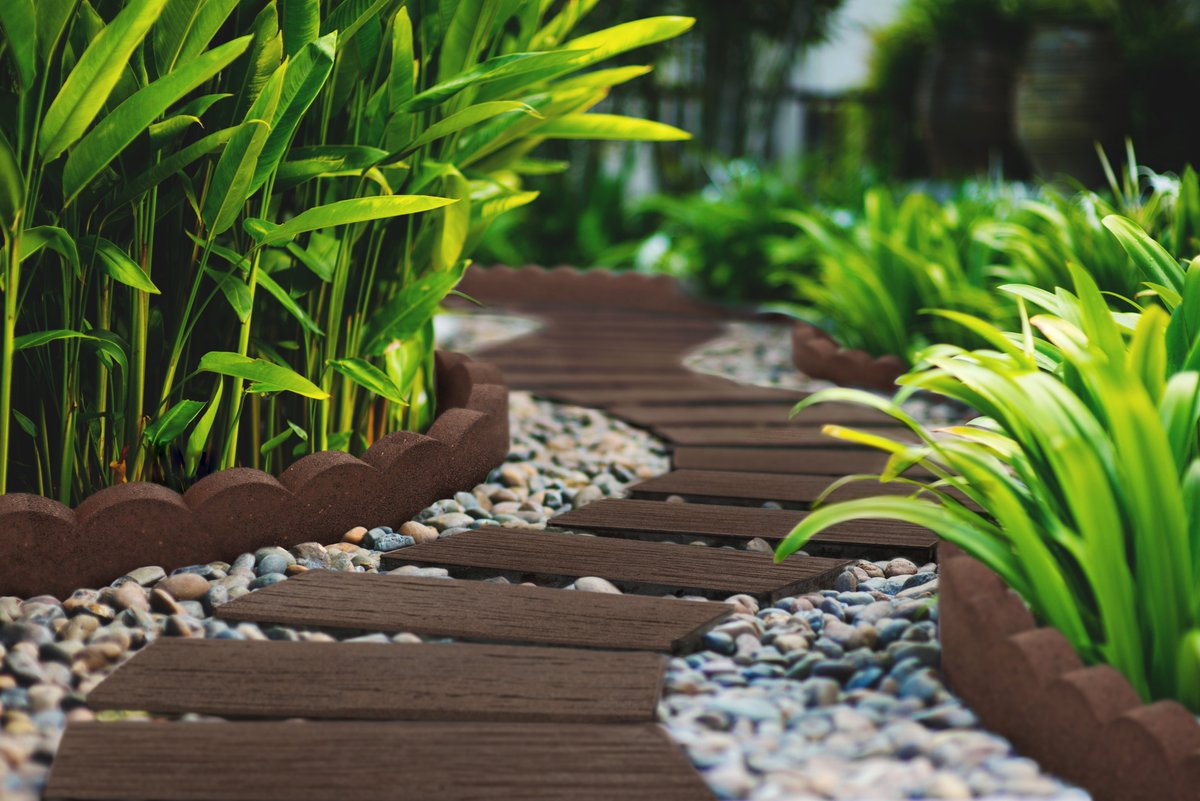 StepGarden's tweet image. Create a meandering path throughout your landscape design with Garden Central's Roadroad Tie stepping stone.  Simply lay the stepping stone in decorative stone such as riverrock, or pea gravel.
