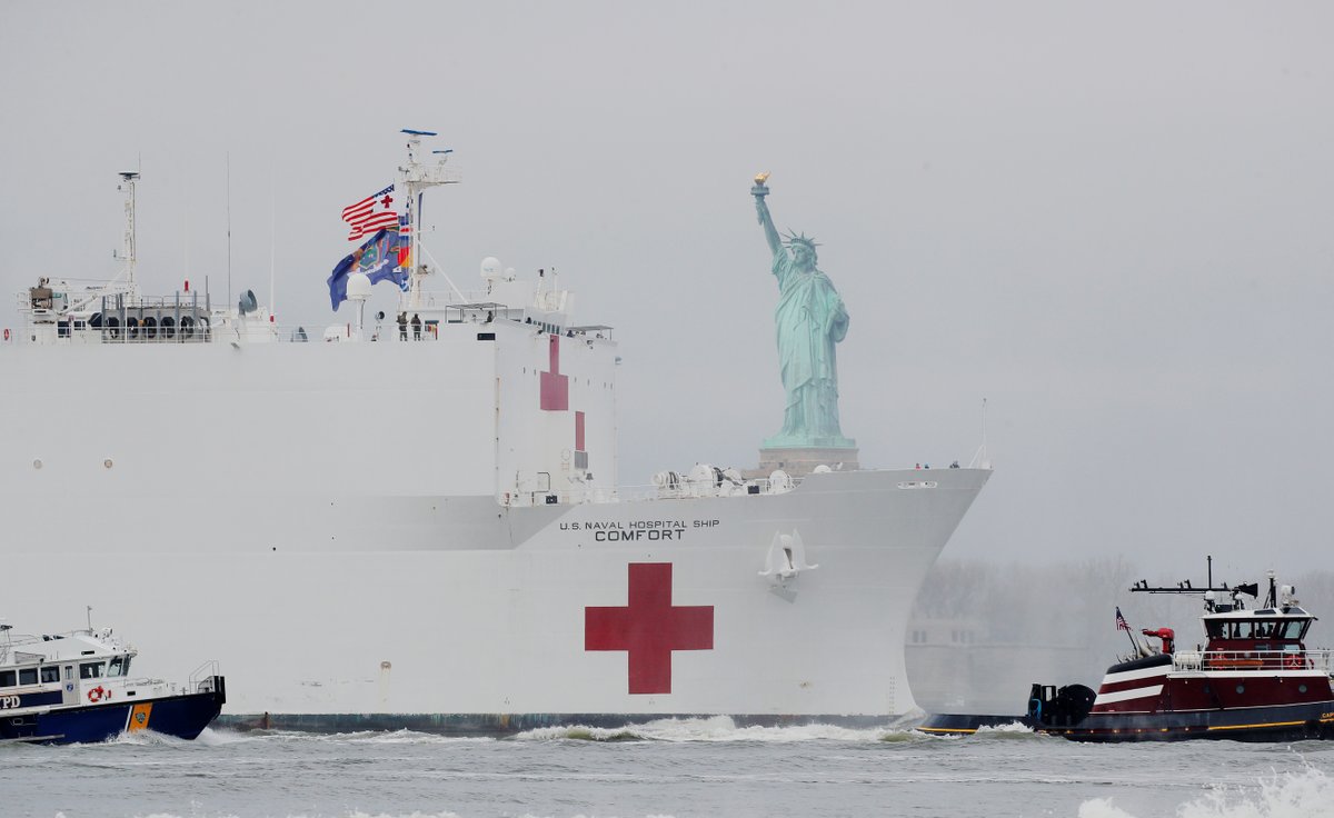 NBCNewsNow's tweet photo. USNS Comfort passes the Statue of Liberty as it enters New York Harbor on Monday morning. https://t.co/FwyYVtq12J