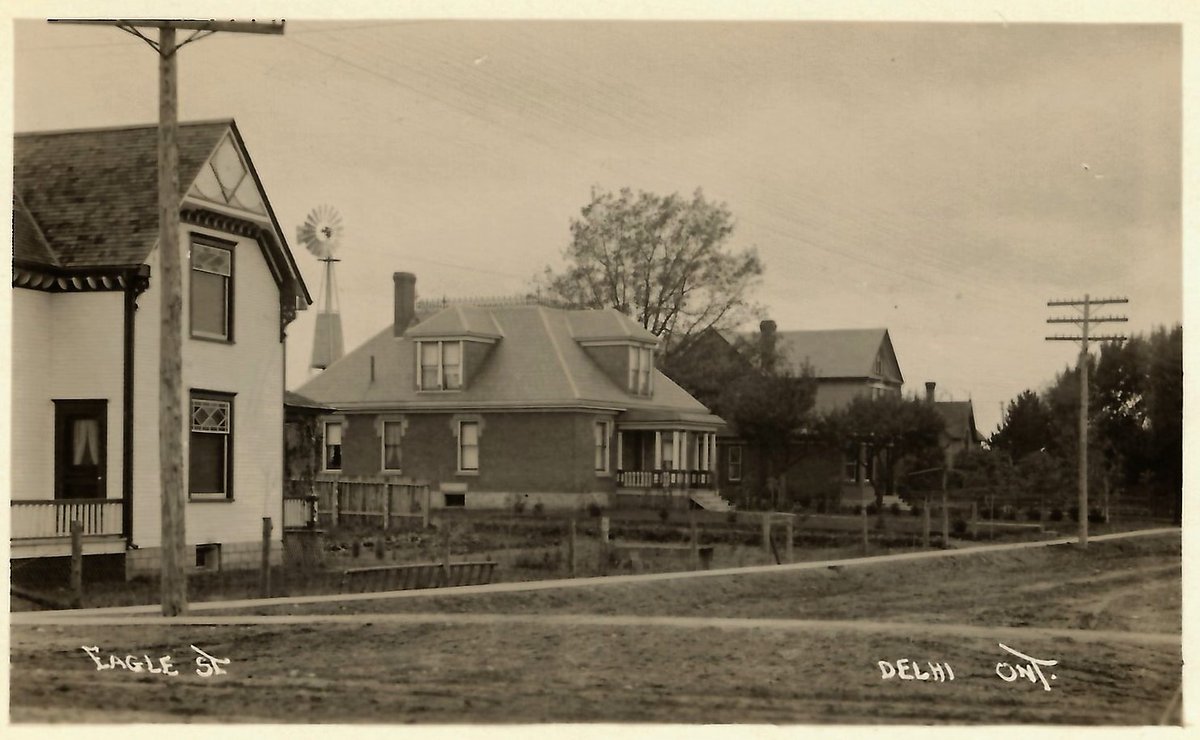 A postcard of various houses on Eagle Street, Delhi, west of Queen. Note the dirt road and intersection before the days of paved surfaces.