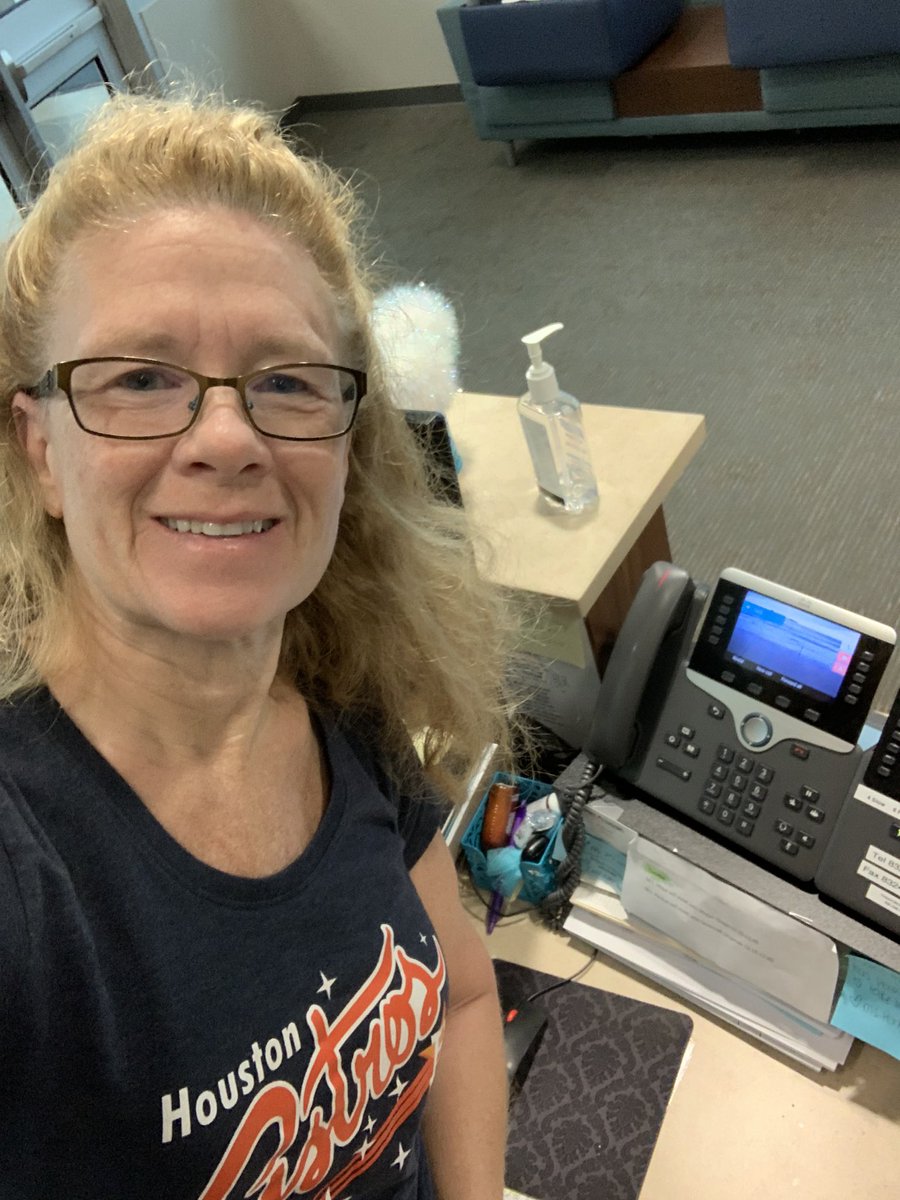 kzwickipedia's tweet photo. At school checking messages and forwarding calls wearing my favorite sports shirt. #ExploreWells #VirtualSpiritWeek #MissingMarchMadness https://t.co/wHvBJQcolg