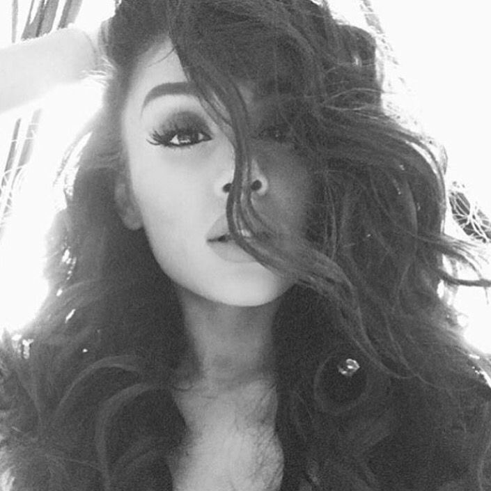 ariana grande curly black hair