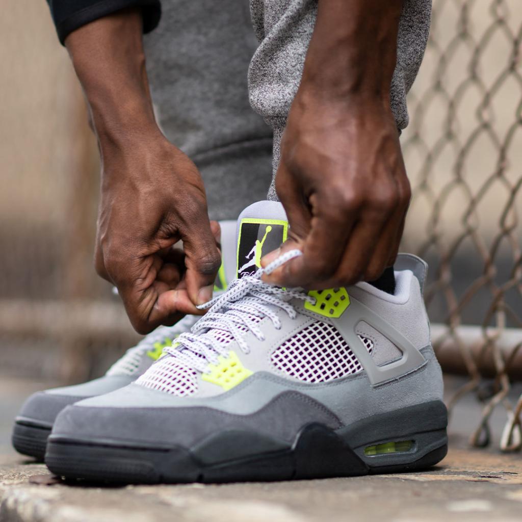 jordan 4 95 neon on feet