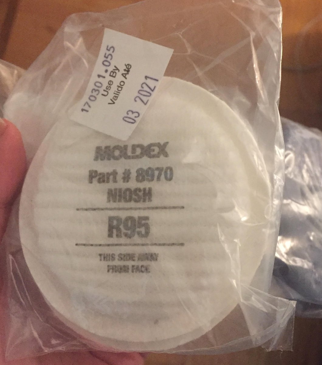 Which disposable piece of equipment looks easier to manufacture, the N95 respirator (with multiple parts) on the left, or the R95 (equivalent protection to N95) filter insert for an elastomeric on the right?