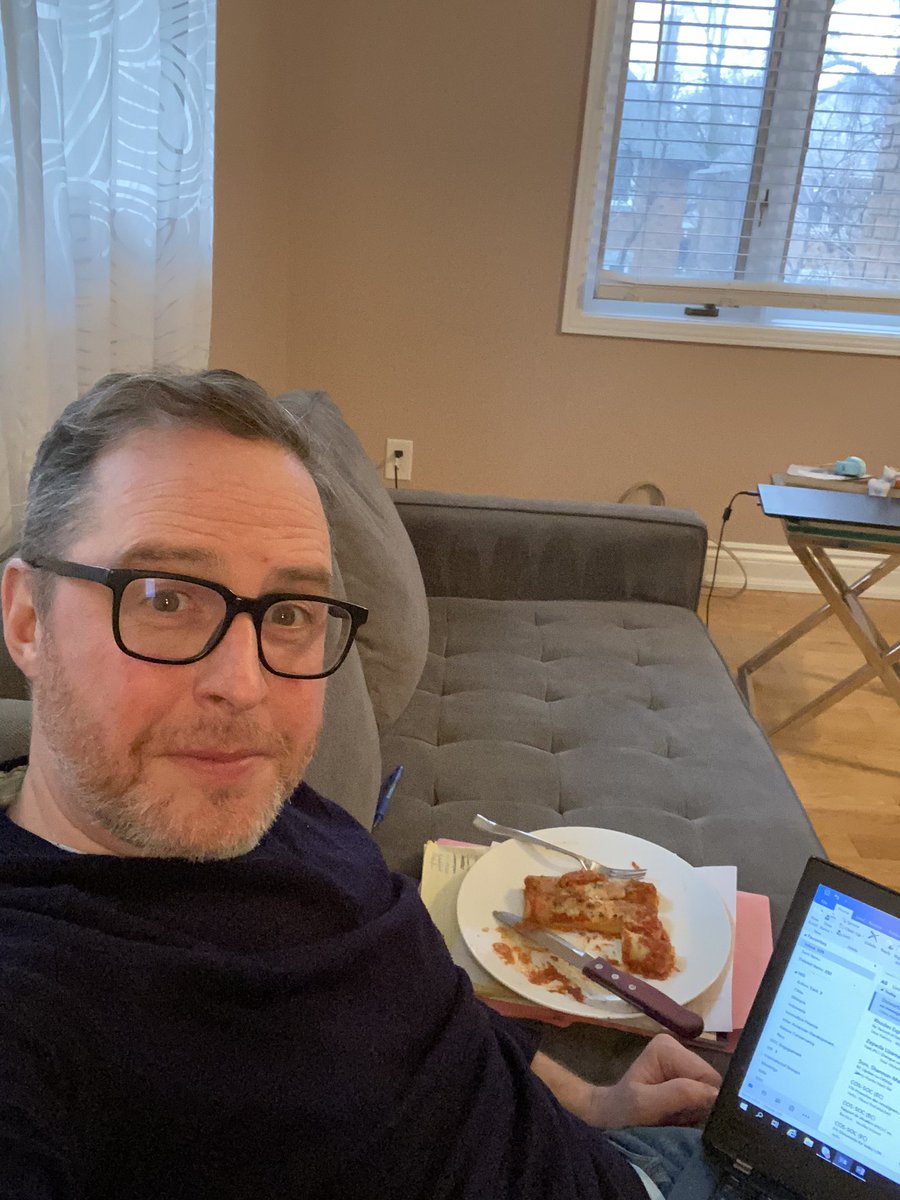 Not since my PhD have I spent so much time working in my bedroom &amp; on couches. It’s not great for a trick back but the luxury is not lost on me. Manicotti for one? #COVID19 #StayHomeCanada #weirddadbeard #hidingfromtoddlers #wallsarentbeigeiswear #badlight #artcollegedropout