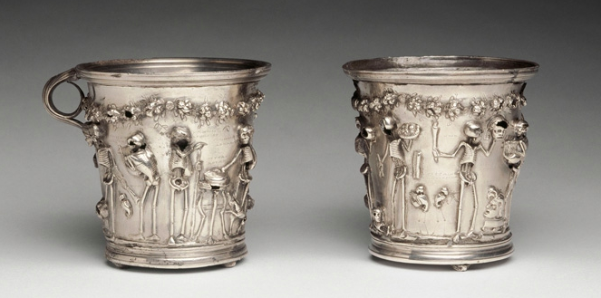 this is not the only instance of festive skeletons at the Roman dinner party. These remarkable silver cups from the Boscoreale treasure (now Louvre Bj 1923 and Bj 1924) ft the skeletons of famous poets and Greek philosophers (all labeled and having a great time!)