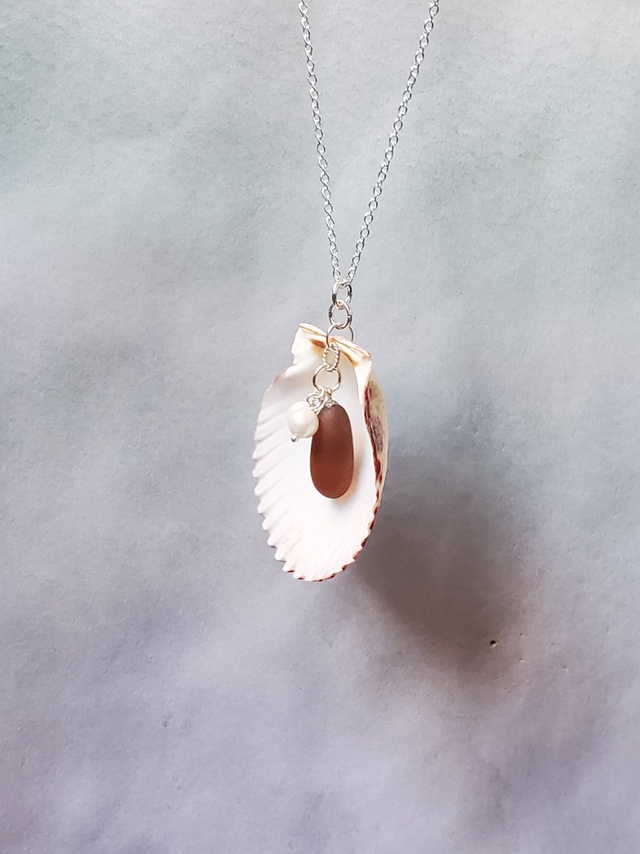 saltedbayonet's tweet photo. A #handmade, genuine purple #seaglass, pearl, #scallopshell &amp; sterling silver necklace.  https://t.co/KsTw0E0JTr #seaglassjewelry #genuineseaglass #purpleseaglass #surftumbled #handmadejewelry #seaglassnecklace #beachlife #shelljewelry #handmadenecklace #shellnecklace #oceanlife https://t.co/u4gysfwB0D