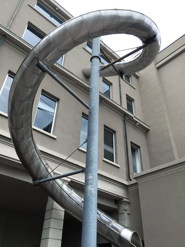 StreetFashion01's tweet photo. Miuccia Prada has a Slide that takes her from her top floor office all the way down to the ground floor. Now that’s iconic. https://t.co/Z0dPLKvSMu
