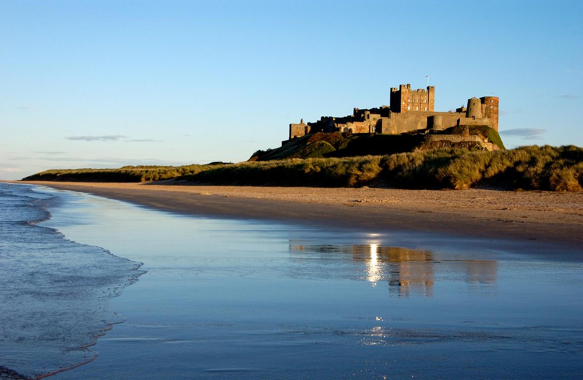 HE_NorthEast's tweet photo. You might not be able to visit your favourite historic sites at the moment but we can bring them to your home. Here's Bamburgh Castle in all its glory. Image from @HE_Archive  #Northumberland https://t.co/eWJdNeanSH