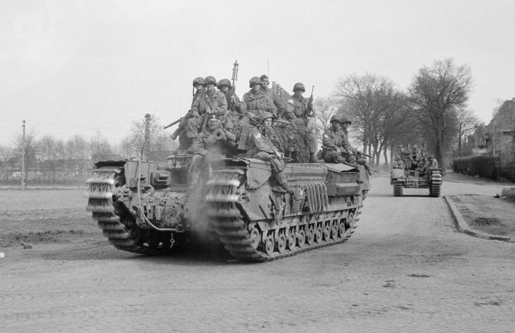 guards_museum's tweet photo. US Paratroops on tanks, driven by British #FootGuards. 513 PIR rode on 6th Guards Tank Brigade tanks to speed the advance towards Munster. I say speed but the Churchill tanks only went 15 mph (a Sherman was around 25 mph) so they continued through the night to keep momentum. https://t.co/SRvR1suFyU