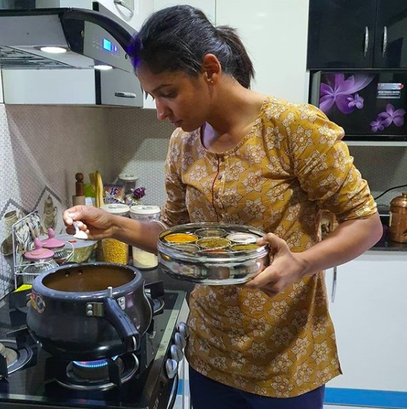 Harmanpreet Kaur trying a new dish. PC: Twitter