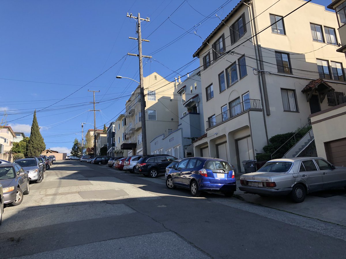 MultiModalMom's tweet image. Public space dedicated for people walking has never been more sacred yet we have a whole street in Oakland with cars parked across the sidewalk. How? Why? #oakland #COVID19 #socialdistancing #parking #sidewalk