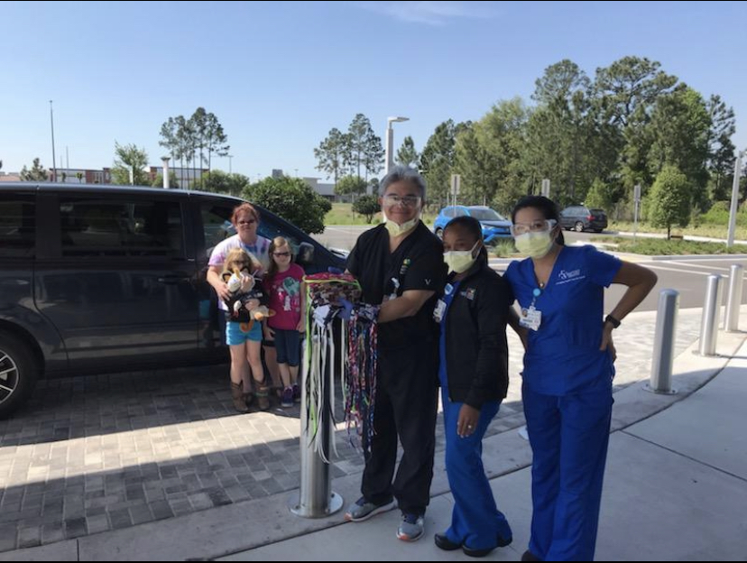 gsgc's tweet photo. Girl Scouts Brianne and Annalynn have been helping their mom sew masks around the clock to donate to Jacksonville hospitals and other care providers. Even when they're at home or facing a challenging time, #GirlScoutsGiveBack and find ways to make the world a better place! 💚🏥 https://t.co/x0ivzeEnun