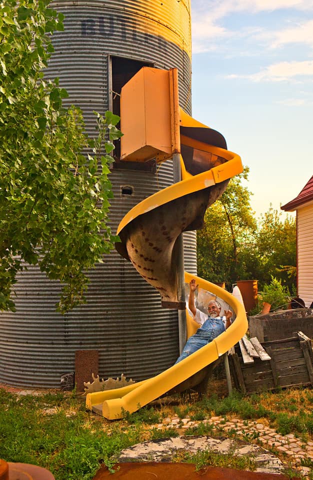 VisitPalisade's tweet photo. Local Palisade #artists enjoying their time at home! Artist Lyle Nichols is known for his unique sculptures and charismatic personality. That slide though! #envy #QuarantineLife  #colorado #people https://t.co/vQ6cXd64qT