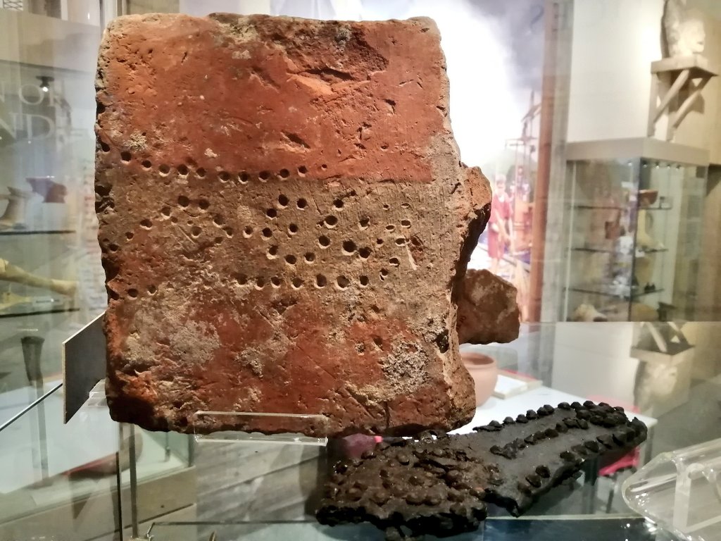 Roman_Britain's tweet photo. Haven't had a #TegulaeTuesday for a while. Coming back in style, this #Roman tile from #Gloucester has an adult hobnail sole print in it.. Similar (but different pattern) to the example beside it. #RomanBritain #RomanArchaeology #VirtualMuseum #Romans #MuseumFromHome #Archaeology https://t.co/5WwF4VmnhV