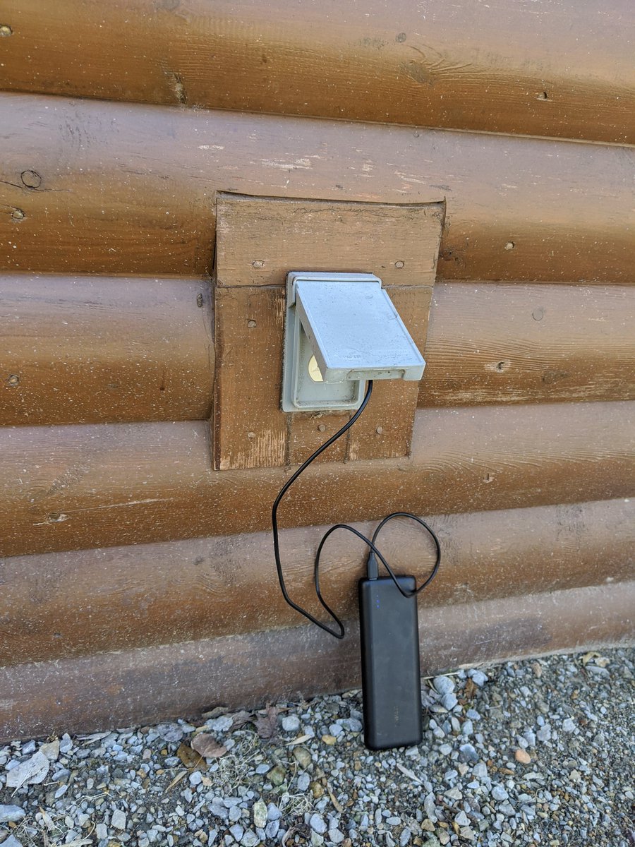 The park's visitor center is closed, but it still has all the resources I need: outlets (even my 20,000 mAh battery was getting down towards 50%), a spigot, a picnic bench, and wifi! My phone immediately started downloading eight new podcast episodes.  – at  Sakatah Lake State Park