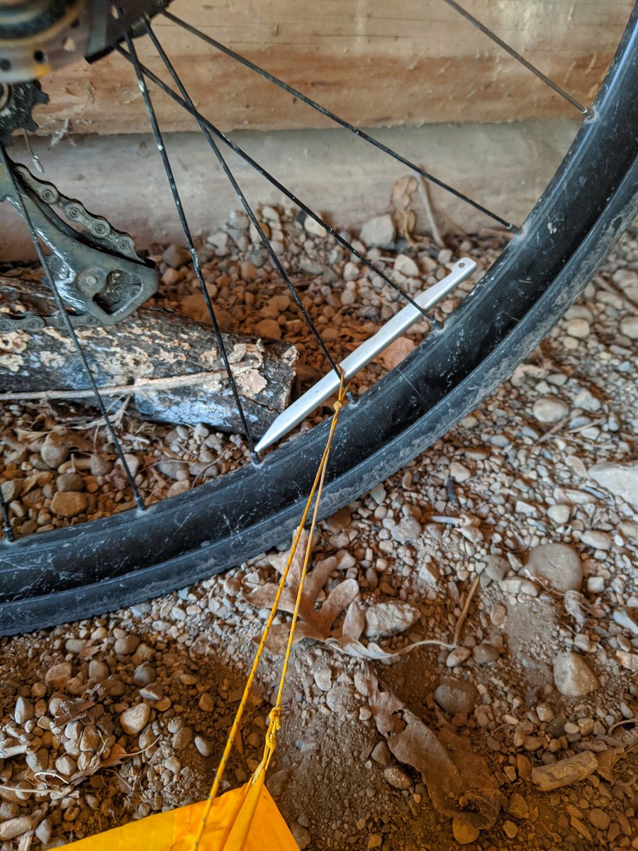 Dinner this evening is a just-add-water-and-boil tortellini meal. All the comforts of home!The rocky ground was a little tough to get my tent stakes into, but my bike was right next to it, so I got a little creative. – at  Sakatah Lake State Park