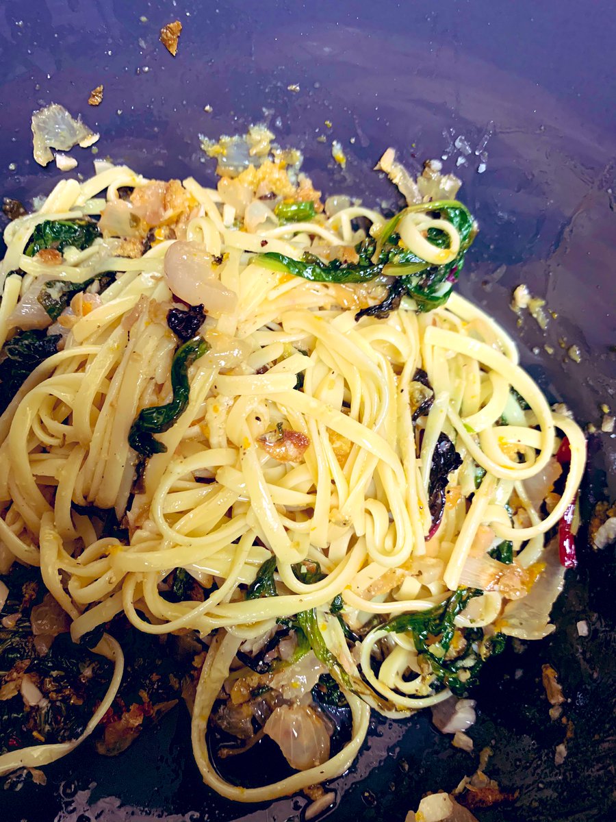 Here’s what it looks like with its linguini . It’s very delicious. The sautéed salad greens are tender and silky. The double zest and breadcrumbs make it luxurious.
