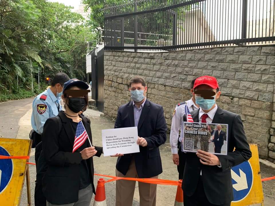 HKAA2019's tweet photo. Today our flag bearers went to the US Consulate and presented a petition for the US to ask for raparation on behalf of HK for the tremendous loss incurred by the Chinese Virus. We told them about the unproportional fascist control by HKgov in the excuse of disease control. https://t.co/zcafOrUI3d