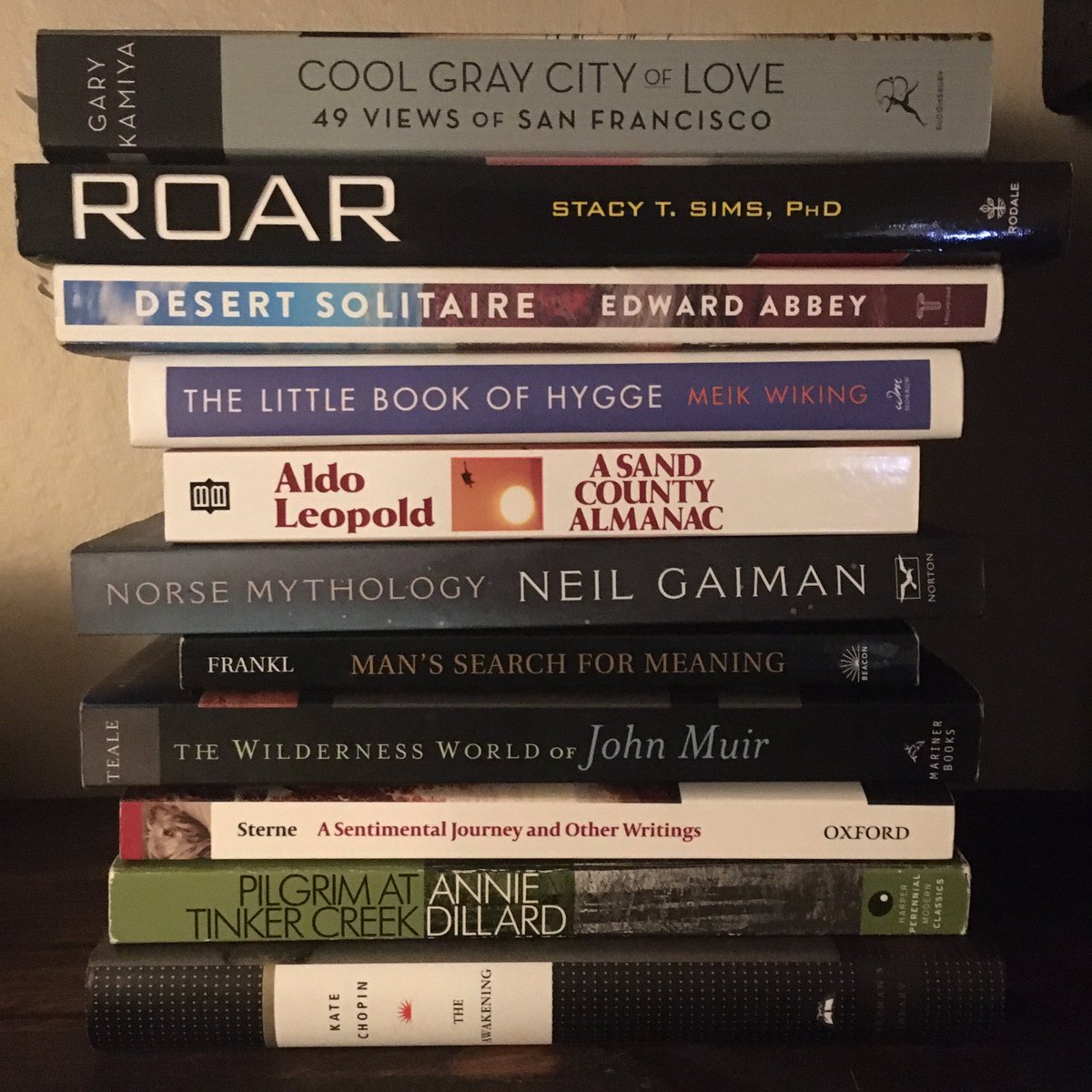 JWalkWriter's tweet image. The “10 books in 10 weeks” challenge at my work starts tomorrow! Here are mine. I added a bonus 11th because I’m already halfway through Cool Gray City of Love. (I’ve read The Awakening a hundred times but I love it so it’s my “dessert” book.) 📚🤓
