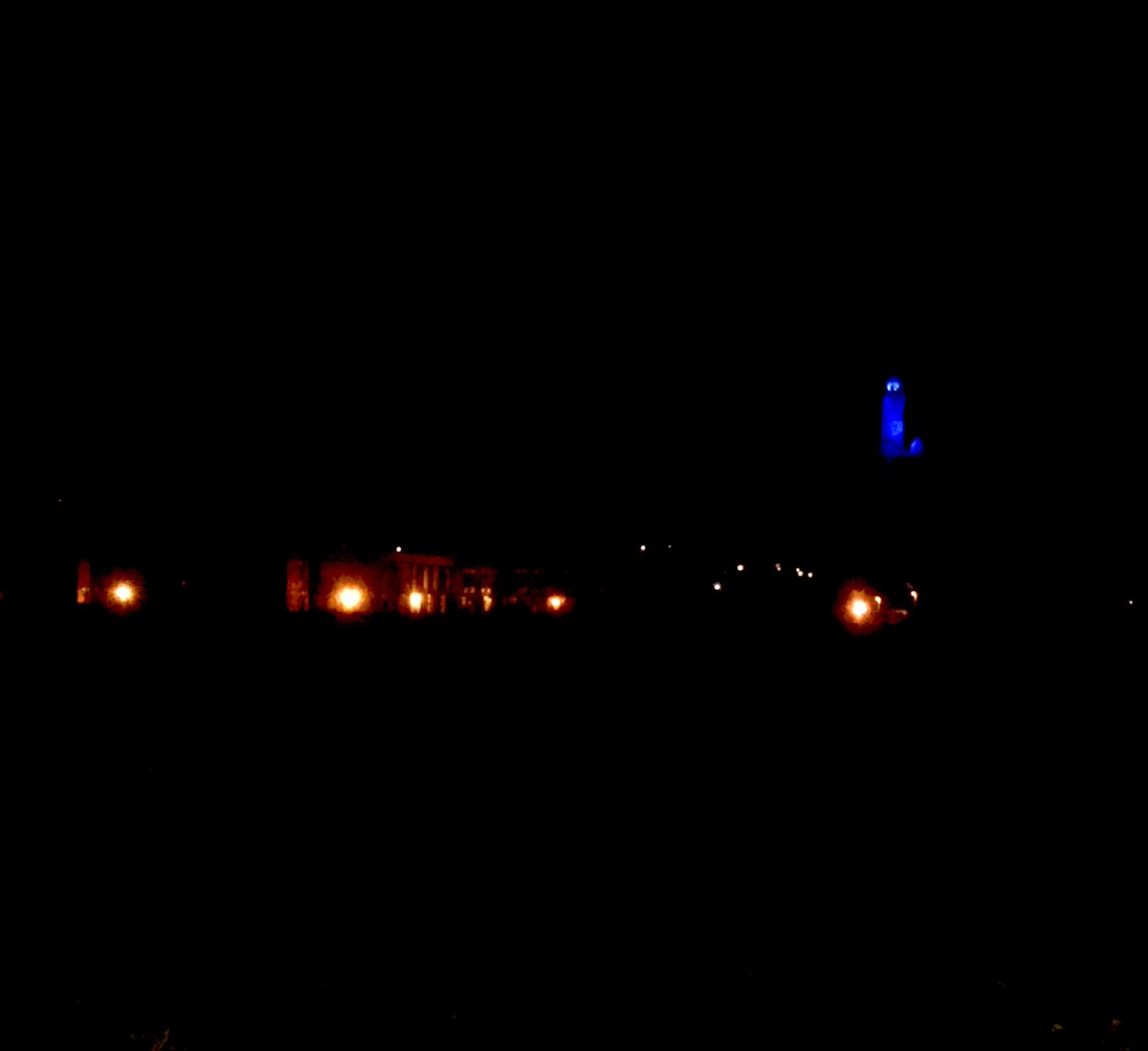 Wallace High School and the Wallace Monument, lit up blue to say #ThankYouNHS